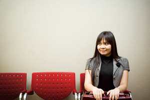 person sitting in chair waiting to be called in for interview